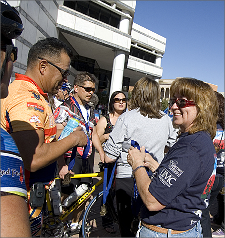 Bicycle photography - riders receiving their 2009 El Tour de Tucson finisher medals