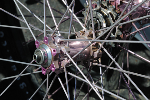 Bicycle photography - pink wheel hub at spring 2011 Bike Swap Meet, Tucson, Arizona