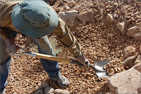 Construction photography - Shoveling inorganic landscaping mulch