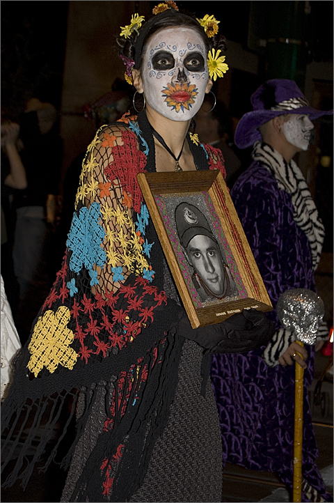 Woman remembering a loved one in All Souls Procession 2009 through Downtown Tucson, Arizona