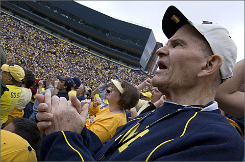 Event photography - William Retallick cheers during Michigan-Indiana football game, University of Michigan, Ann Arbor