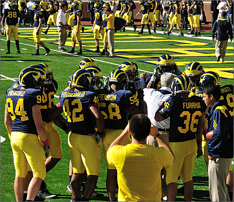 Event photography - Michigan Wolverine football team doing warmups before the 2010 Homecoming Game