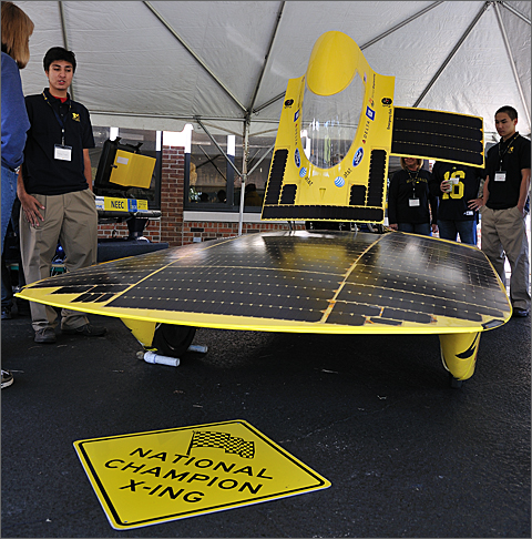 Event photography - University of Michigan Solar Car Team members and their championship vehicle