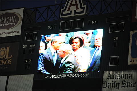 Event photography - President Barack and First Lady Michelle Obama on video feed into Arizona Stadium in Tucson