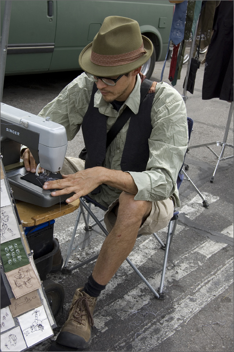 Event and bicycle photography - Embroiderer P. Nosa at Bicycle Swap Meet, Tucson, Arizona
