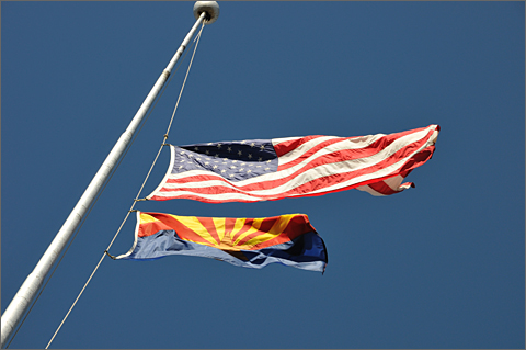 Event photography - University of Arizona state and federal flags lowered to half staff to commemorate the victims of the January 8, 2011 shootings in Tucson