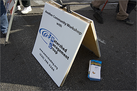 Event photography - Watershed Management Group sign at 4th Avenue Street Fair in Tucson, Arizona