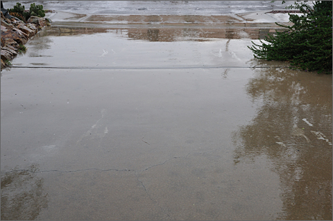 Photo essay - water running off driveway and into street during Tucson, Arizona rainstorm on September 11, 2012