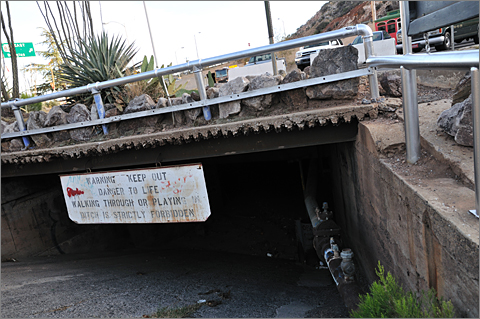 Travel photography - Ditch with warning sign in Bisbee, Arizona