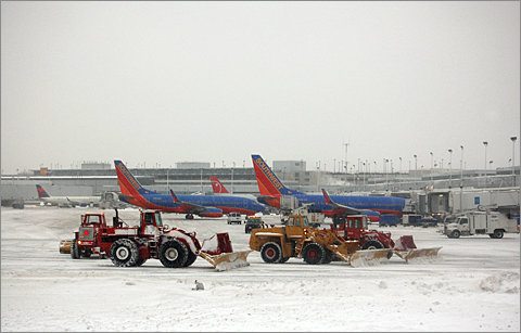 Travel photography - Snowplows and planes at Chicago Midway Airport, Illinois
